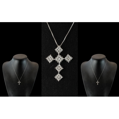 273 - 9ct White Gold Diamond Cross, set with 54 round brilliant cut diamonds, suspended on a 9ct white gol... 