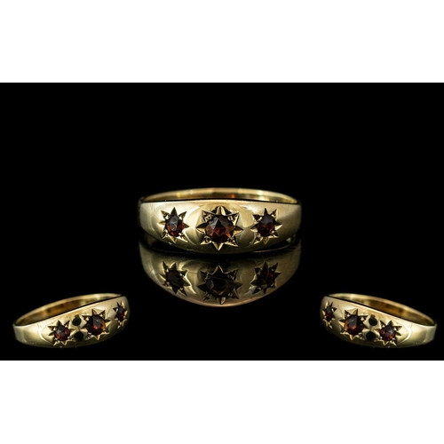32 - Early 20th Century - Attractive 9ct Gold Band Ring. Set with 3 Garnets In Star burst Surrounds. Full... 