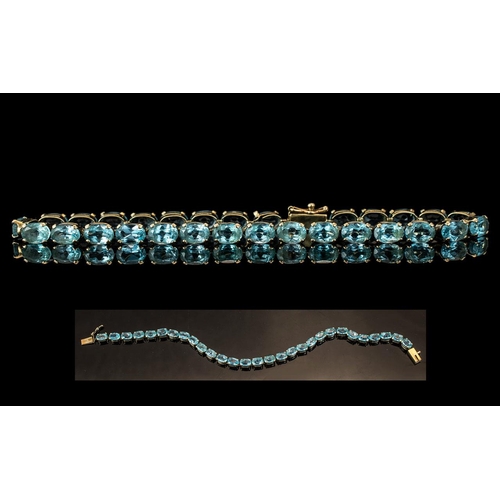 82A - Ladies - 9ct Gold Pleasing Blue Topaz Set Line Bracelet. Fully Hallmarked for 9.375. Well Matched To... 