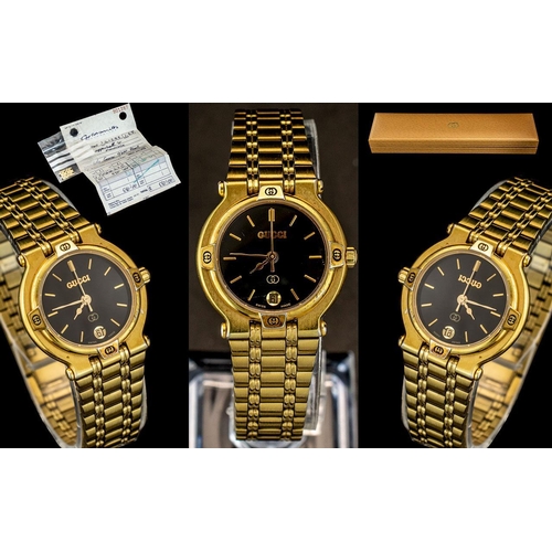 86 - Gucci Ladies Gold Plated Deluxe Wrist Watch. Ref No 9200-L. Features Black Dial, Gold Markers, Secon... 