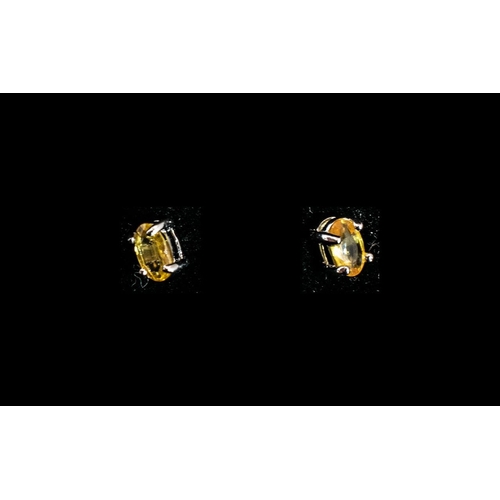 253 - Yellow Sapphire Stud Earrings, solitaire oval cut yellow sapphires, a colour considerably rarer than... 