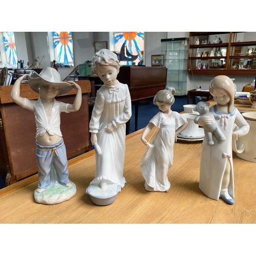 701 - A Collection of Nao by Lladro Figures (3) in total. Comprises a boy with cowboy hat on, a girl in ni... 