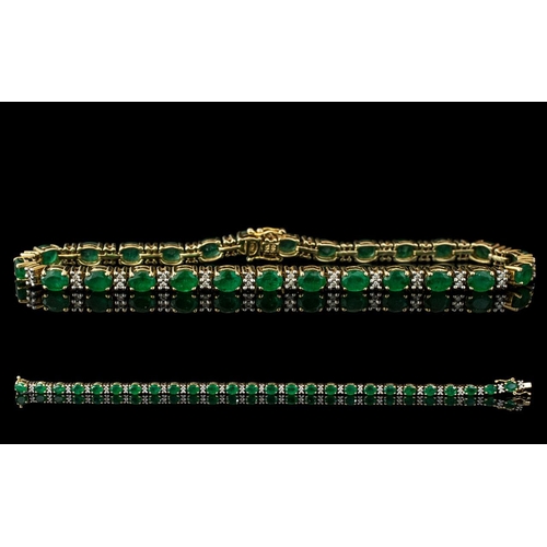 26 - 14ct Yellow Gold Attractive Emerald and Diamond Set Line Bracelet. Marked 14ct - 585. The Faceted Em... 