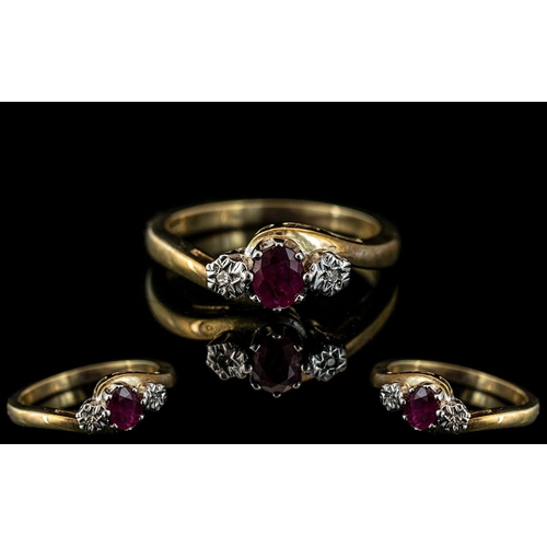 323 - Ladies Attractive 9ct Gold Ruby and Diamond Set Ring. Full Hallmark for 9.375. The Faceted Ruby of G... 