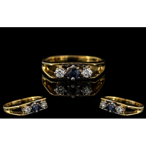 329 - 18ct Gold - Attractive 3 Stone Sapphire / Diamond Set Ring with Open Shoulders. The Two Found Diamon... 