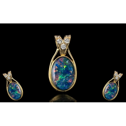 35 - A Superb 18ct Gold Large Black Opal and Diamond Set Pendant. Marked 750 - 18ct. The Large Oval Shape... 