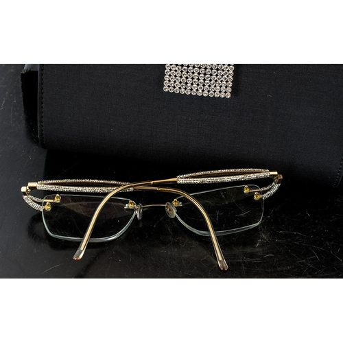 397 - **WITHDRAWN**Three Pairs of Designer Spectacle Frames, including a pair of Tsuki 18ct gold frames, w... 