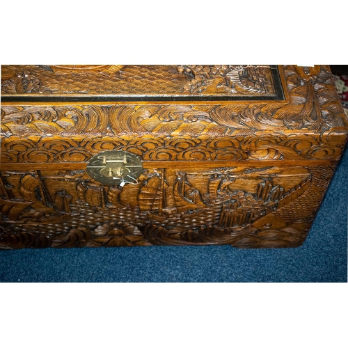 79B - A Heavily Carved Camphor Wooden Blanket Chest. Depicting a Docking Scene, surrounded  by Koi Fish an... 