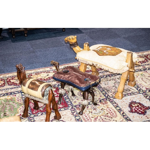 1025 - A Collection Of Three Camel Stools All Three Of Various Designs Of A Wooden Construction With Padded... 