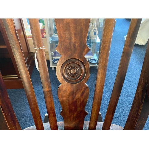 1031 - Traditional Oak Rocking Chair with spindle back and carved centre panel.  Measures 40'' tall, width ... 