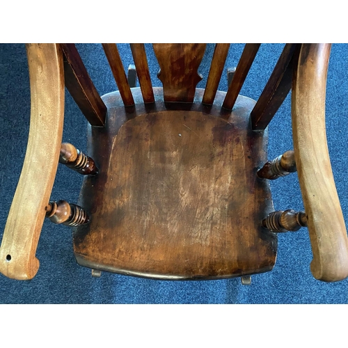 1031 - Traditional Oak Rocking Chair with spindle back and carved centre panel.  Measures 40'' tall, width ... 