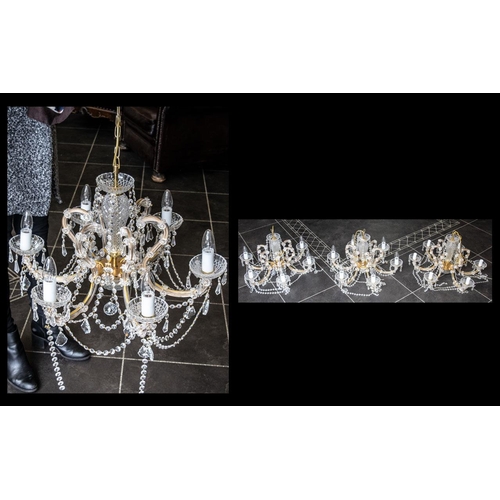 1034 - Three Matching Decorative Crystal Chandeliers, each set with six candle lights, crystal drops and cr... 