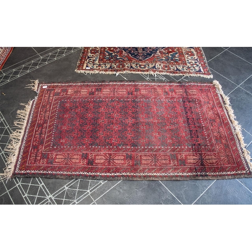 1050 - Two Wool Rugs, both with signs of wear, traditional wool rug border pattern with central diamond des... 