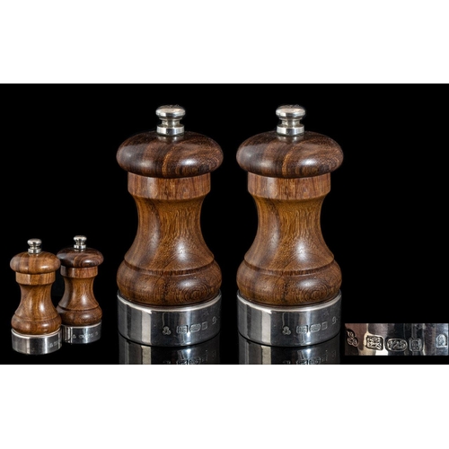 107 - Elizabeth II - A Fine Pair of Sterling Silver and Wooden Salt and Pepper Grinder. London Hallmark, M... 