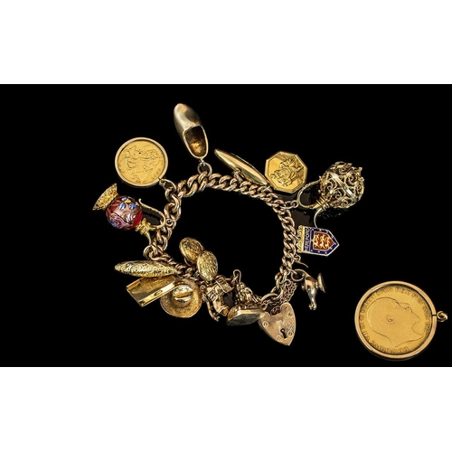 113 - A Vintage Good Quality 9ct Gold Charm Bracelet, loaded with 14 9ct Gold Charms, plus 1 1/2 sovereign... 