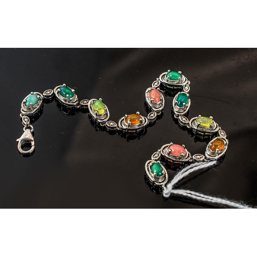 127 - Multicoloured Opal Line Bracelet, the beautiful oval cut cabochon, Ethiopian opals in a range of col... 