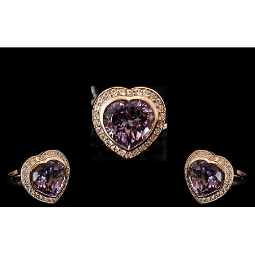 128 - Amethyst Heart Shape Halo Statement Ring, a 12ct, heart cut, wonderful amethyst, held in a heart sha... 