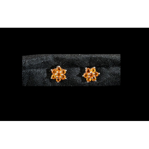 129 - Fire Opal Flower/Star Shape Earrings, each earring holding seven round cut, fiery orange, Mexican fi... 