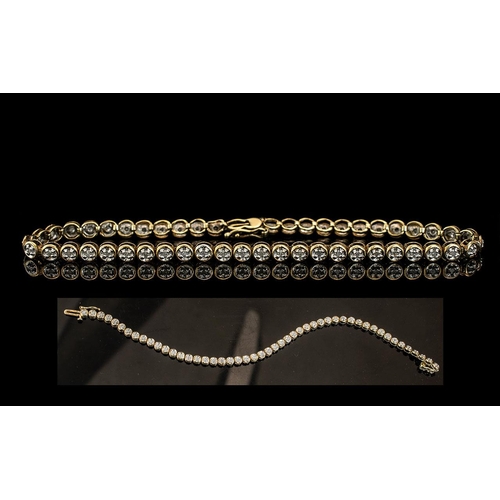 131 - 9ct Gold Diamond Set Line Bracelet. Full Hallmark for 9,375. Est Diamond Weight 0.50 pts. Diamonds o... 