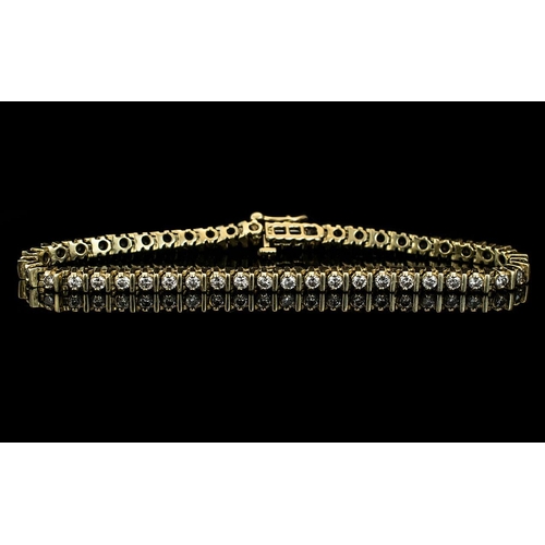 134 - A 14ct Gold Diamond Tennis Bracelet Set With 46 Round Modern Brilliant Cut Diamonds. Estimated Diamo... 