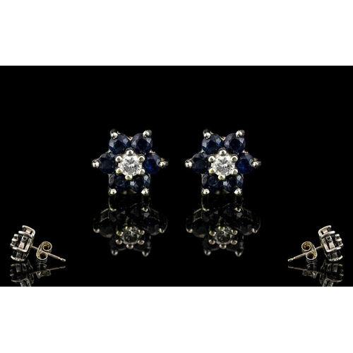 420 - 18ct White Gold Earrings Set with Diamonds & Sapphires with a flower head setting.  Stamped 18ct.