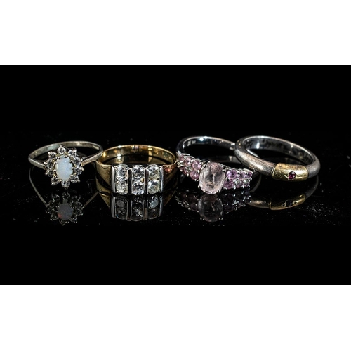 434 - 9ct White Gold Dress Ring set with pink stones, weight 2.9 grams, together with three unmarked white... 