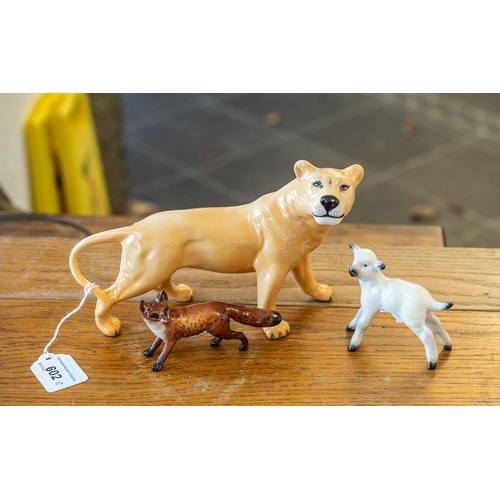 602 - Three Beswick Figures, comprising a lioness measuring 6'' tall x 9'' long, a fox measuring 2.5'' tal... 