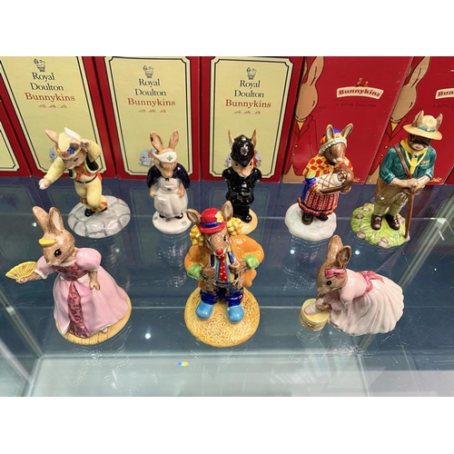 623 - Collection Of 8 Royal Doulton Bunnykins - To Include 'Clarence The Clown,' 'Summer Lapland,' 'Scout ... 