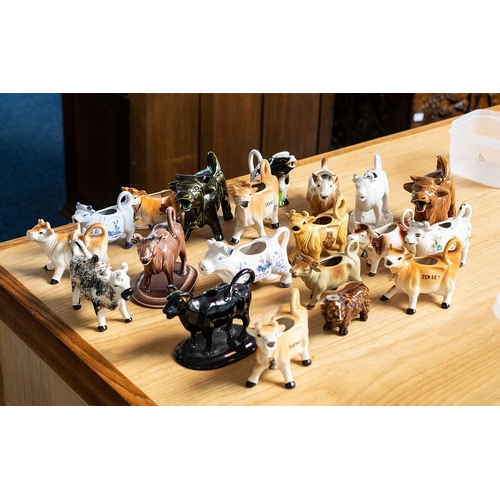 626 - Large Good Collection of Porcelain Cow Creamers. Various Shapes, Sizes and Makes. Includes Staffords... 