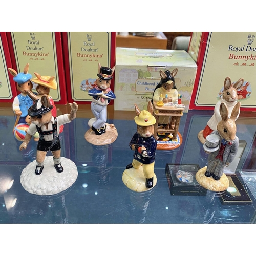 634 - Collection Of 7 Royal Doulton Bunnykins - 'To Include 'Hornpiper,' 'Choir Singer,' 'Fireman,' 'Groom... 