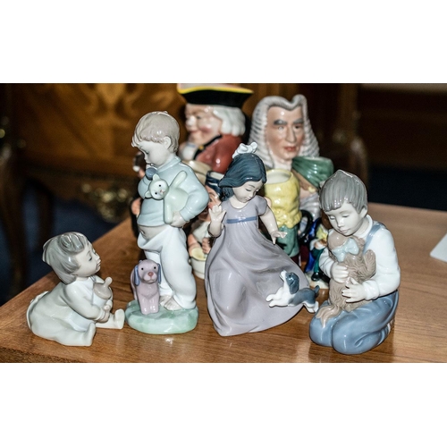 666 - Four Nao Figures, comprising 'Boy on Phone with Dog', 'Baby & Bottle', 'Boy Cuddling Dog', 'Girl wit... 