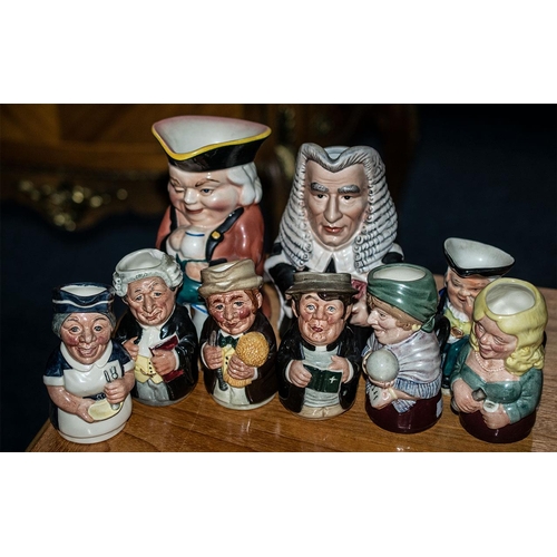 668 - Collection of Toby Jugs, comprising 'The Winker' 6.5'' tall, six Royal Doulton Miniature Toby Jugs '... 