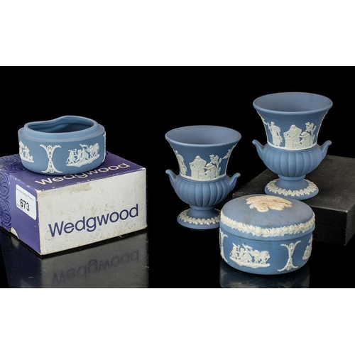 673 - Collection of Wedgwood Blue Jasperware, comprising urn vases and pots.  Four in total, one boxed.