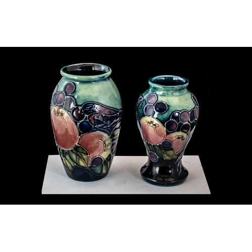 678 - Two Moorcroft Miniature 'Finches' Vases, designed by Sally Tuffin circa 1988.  4'' high.  Marked to ... 