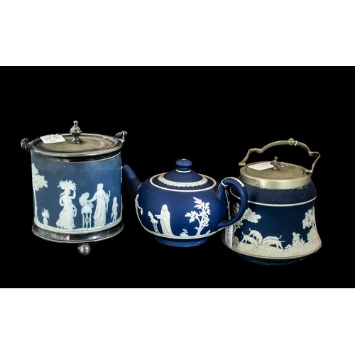 715 - Three Pieces of Wedgwood Jasper Ware.  To include a teapot, and two biscuit barrels, two with Arcadi... 