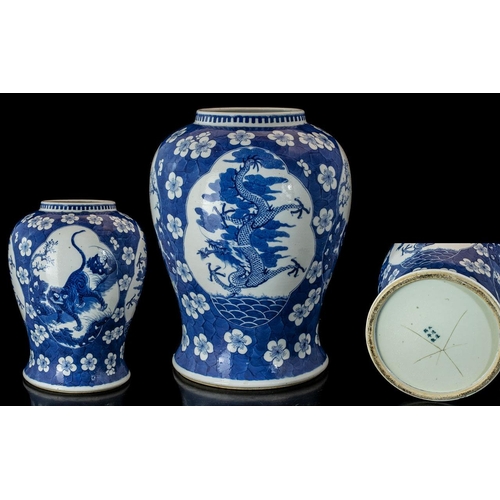 800 - A Large Antique 19th Century Chinese Vase, blue and white prunus with four shaped vignettes depictin... 