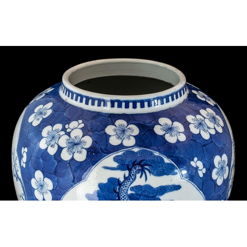 800 - A Large Antique 19th Century Chinese Vase, blue and white prunus with four shaped vignettes depictin... 