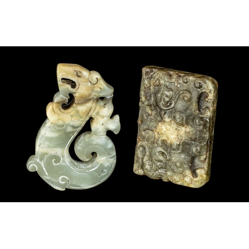 810 - A Pair of Jade Amulets in the archaic style, one in the form of a dragon 2.5'' x 1.75'', the other a... 