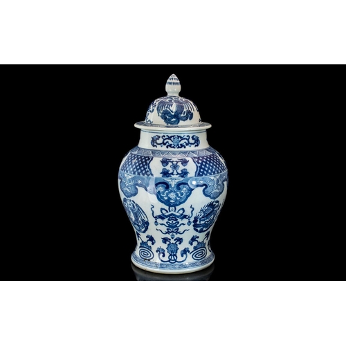 856 - Large Chinese Blue & White Lidded Vase, heavily decorated in dragons, phoenix and precious items.  H... 