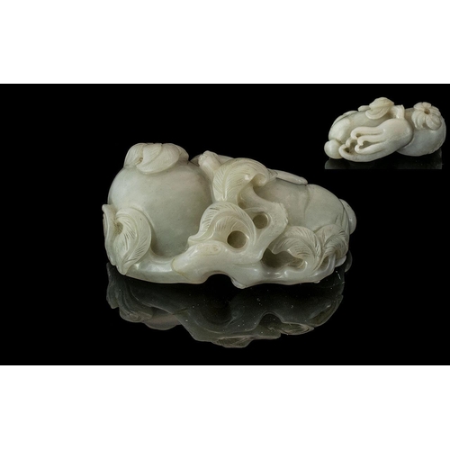 858 - A Large Piece of White Jade in the form of an octupus of typical flora and good colour. Measures 4 i... 