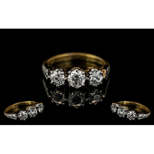 8A - 18ct Gold Attractive 3 Stone Diamond Set Ring, marked 18ct to shank.  The three round brilliant cut ... 