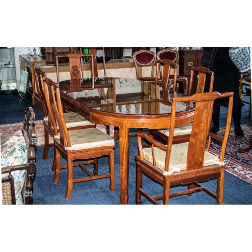 1017 - A Late 20th Century Mahogany Chinese Style Extending Table And Chairs Table Of Circular Form, Six Di... 