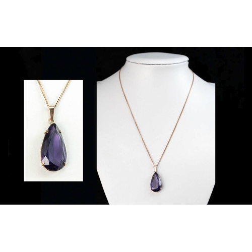 138 - Ladies Attractive 9ct Gold Large Amethyst Tear Drop Pendant, attached to a 9ct gold chain.  Both mar... 