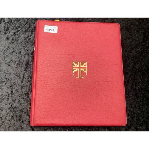 1395 - Stamp interest: Red Stanley Gibbons loose leaf illustrated GB stamp album - Partially filled with se... 