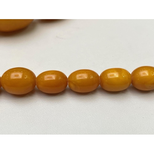 185 - A Fine Quality Early 1920's Butterscotch Amber Graduated Beaded Necklace of Excellent Colour, Well M... 