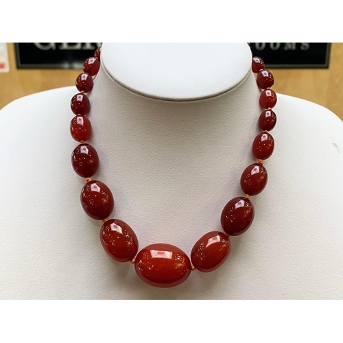 188 - A Fine Quality Cherry Amber Graduated Beaded Necklace. Each Bead Knotted, Wonderful Colour. Length 1... 