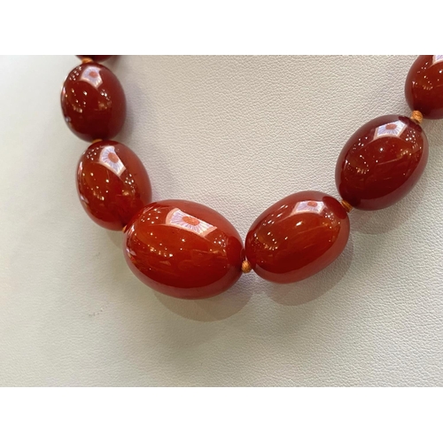 188 - A Fine Quality Cherry Amber Graduated Beaded Necklace. Each Bead Knotted, Wonderful Colour. Length 1... 