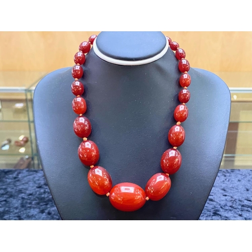 188 - A Fine Quality Cherry Amber Graduated Beaded Necklace. Each Bead Knotted, Wonderful Colour. Length 1... 