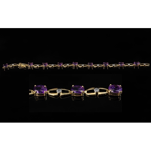 210 - Ladies 18ct Gold - Attractive Amethyst and Diamond Set Bracelet. Marked 18ct. The Nine Oval Shaped F... 