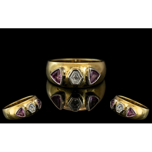 233A - 18ct Diamond Designer Ring, set with a hexagon shaped diamond between two trillion cut rubies.  Full... 